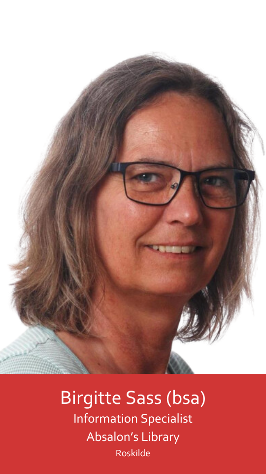 The image shows a middle-aged woman wearing black glasses. Her gaze is directed at the camera, while her body is turned slightly to the right. She is smiling broadly. She has shoulder-length grey-brown hair that hangs loose. She is wearing a white and turquoise striped T-shirt, with the shoulders visible.